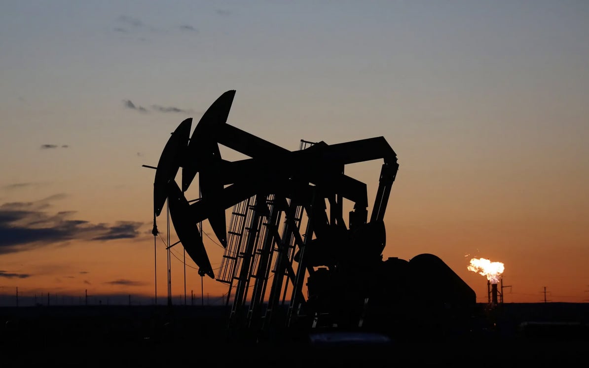 Silhouette of a group of oil pumps